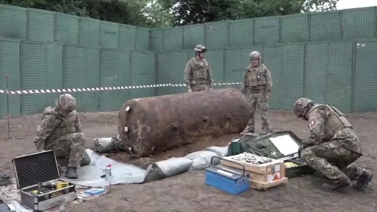 NATO forces, protected by JOESCO hesco barriers, cleared unexploded bombs from WWII.